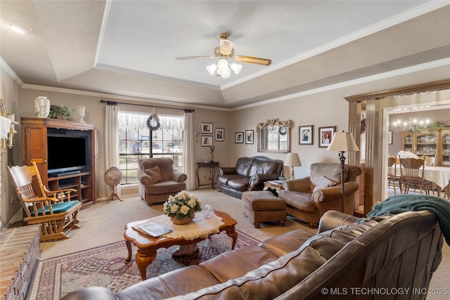 living room featuring light carpet, a raised ceiling, and ceiling fan