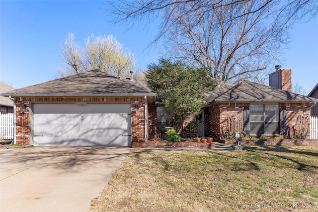 single story home featuring concrete driveway, an attached garage, brick siding, and a front yard