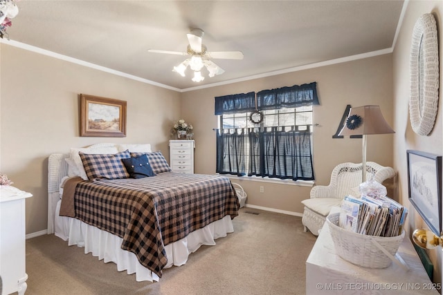 carpeted bedroom featuring ceiling fan, visible vents, baseboards, and ornamental molding