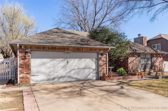 view of front of home featuring fence, driveway, a shingled roof, a garage, and brick siding