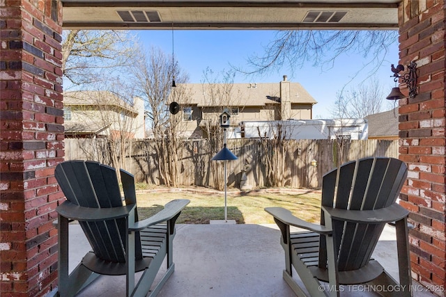 view of patio / terrace featuring a fenced backyard and visible vents