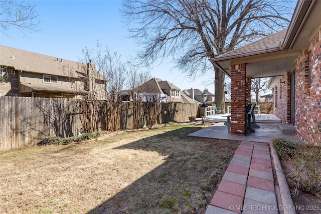 view of yard featuring a patio and a fenced backyard