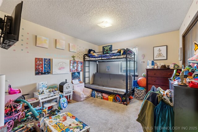 carpeted bedroom featuring a textured ceiling