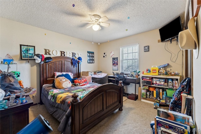 carpeted bedroom with a textured ceiling and a ceiling fan