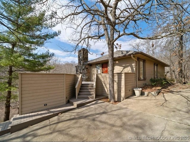 33861 S 4507th Rd, Afton, OK 74331 - back of property featuring a chimney and a patio area