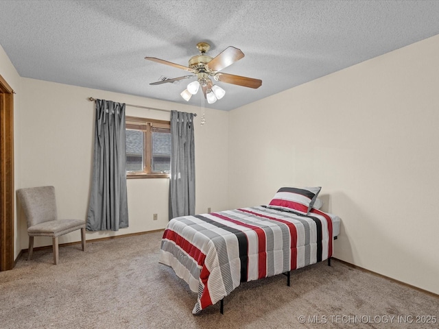 carpeted bedroom featuring ceiling fan, a textured ceiling, and baseboards