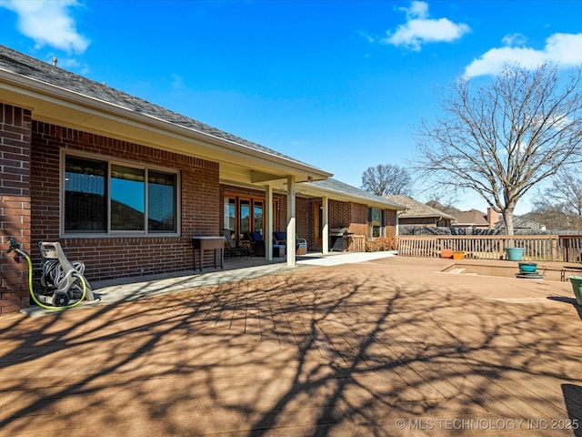 back of property with brick siding