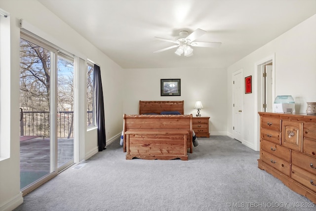 carpeted bedroom featuring visible vents, a ceiling fan, baseboards, and access to outside