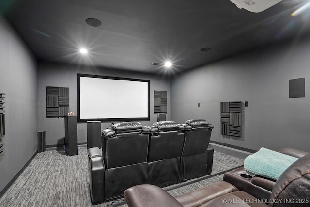 home theater room featuring heating unit, recessed lighting, baseboards, and carpet