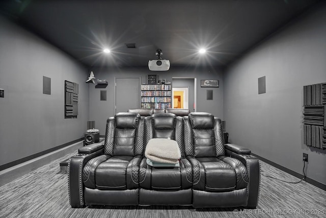 cinema with recessed lighting and baseboards