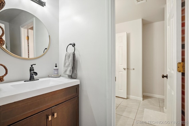 bathroom with tile patterned floors, visible vents, vanity, and baseboards