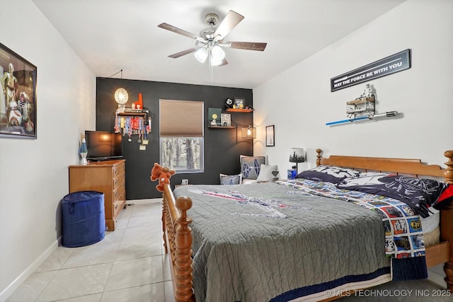 bedroom with tile patterned floors, a ceiling fan, and baseboards