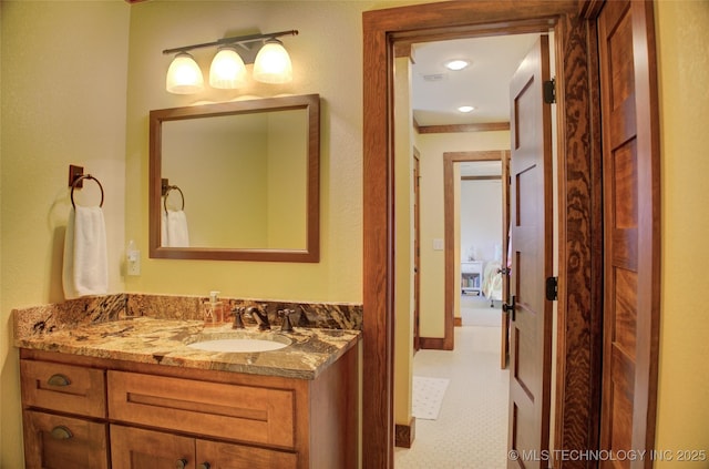 bathroom with tile patterned floors and vanity