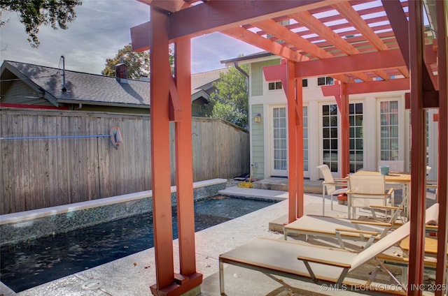 view of patio / terrace with a fenced backyard and a pergola