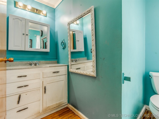 35575 W 87th Pl S, Mannford, OK 74044 - half bathroom with toilet, baseboards, wood finished floors, and vanity