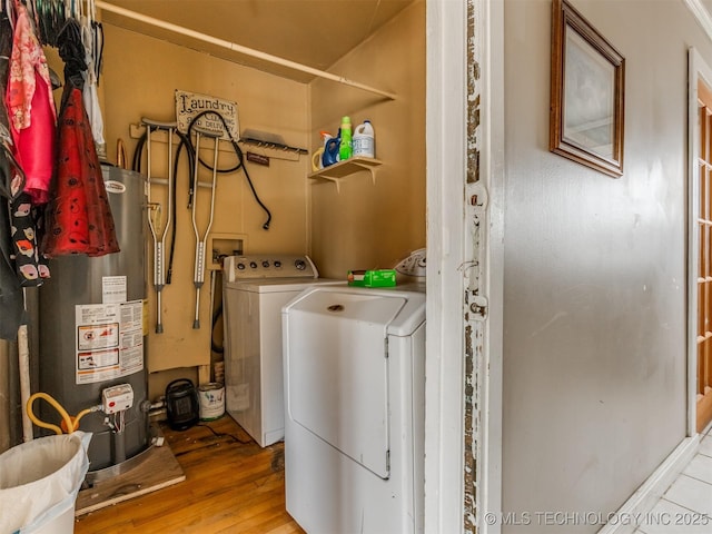 35575 W 87th Pl S, Mannford, OK 74044 - clothes washing area featuring laundry area, washing machine and dryer, wood finished floors, and gas water heater