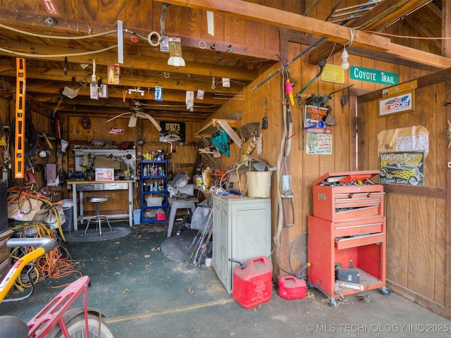 35575 W 87th Pl S, Mannford, OK 74044 - garage with wooden walls and a workshop area
