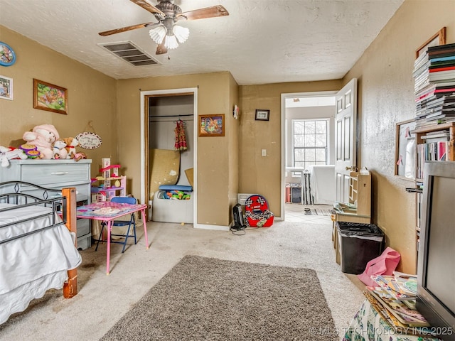 35575 W 87th Pl S, Mannford, OK 74044 - bedroom with visible vents, a closet, a textured ceiling, a ceiling fan, and carpet