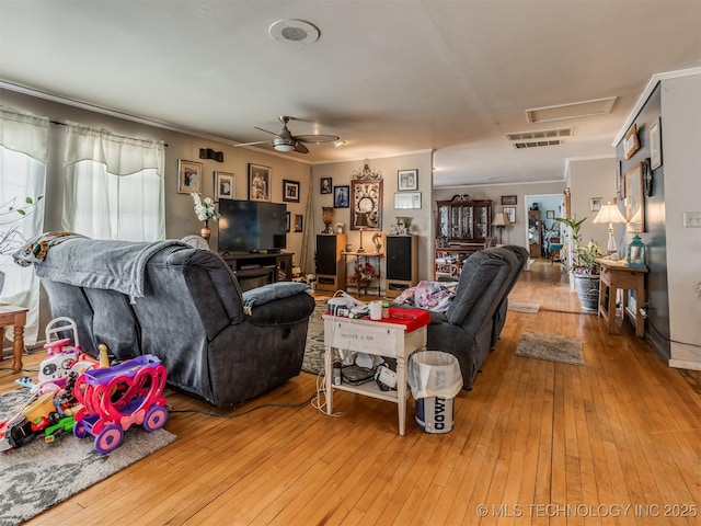 35575 W 87th Pl S, Mannford, OK 74044 - living room featuring visible vents, crown molding, hardwood / wood-style floors, attic access, and a ceiling fan