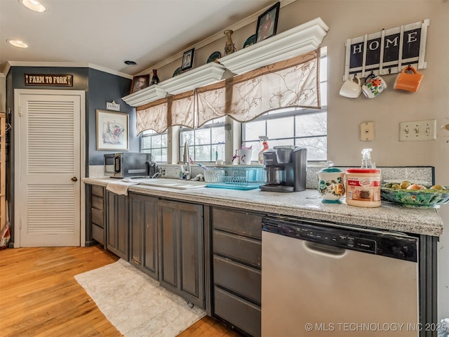 35575 W 87th Pl S, Mannford, OK 74044 - kitchen with light countertops, light wood-style flooring, appliances with stainless steel finishes, and a healthy amount of sunlight