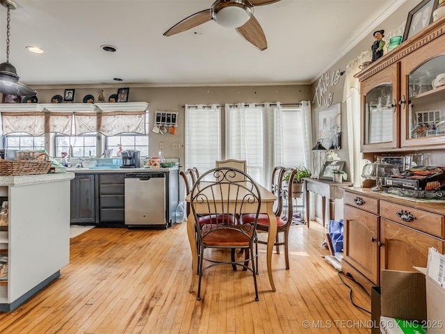 35575 W 87th Pl S, Mannford, OK 74044 - dining room featuring crown molding, a ceiling fan, plenty of natural light, and light wood-style floors
