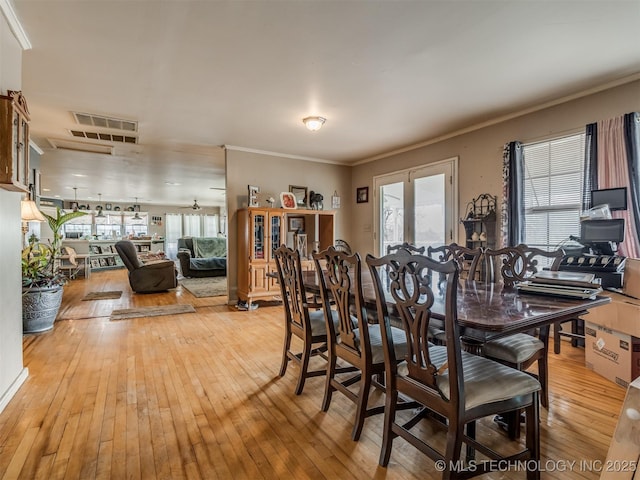35575 W 87th Pl S, Mannford, OK 74044 - dining area featuring a healthy amount of sunlight, ornamental molding, light wood finished floors, and visible vents
