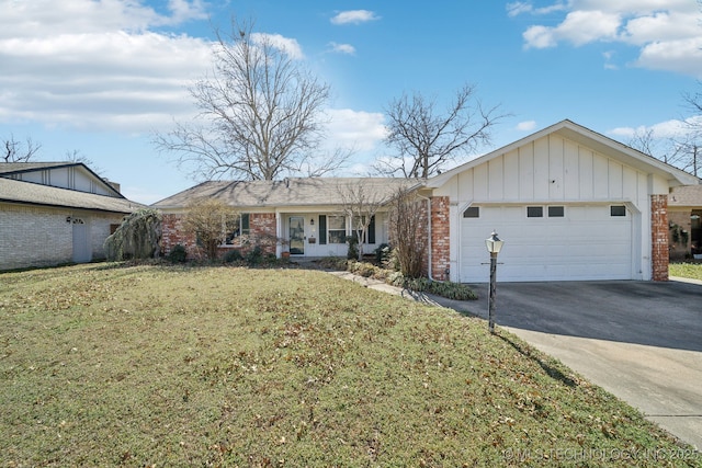 single story home with brick siding, a front yard, concrete driveway, and an attached garage