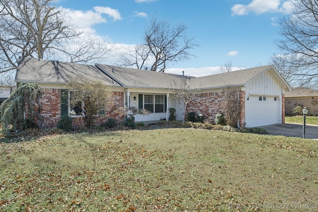 ranch-style house with driveway, a front lawn, brick siding, and an attached garage