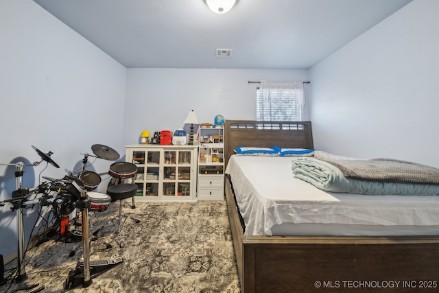 bedroom featuring visible vents and carpet flooring