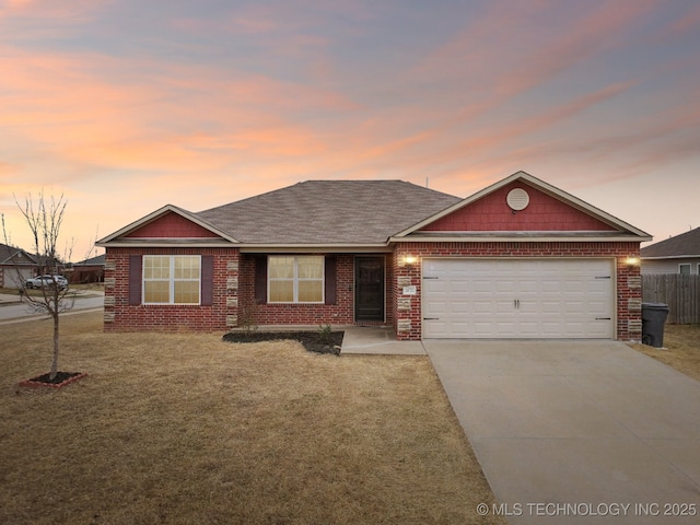 ranch-style house featuring brick siding, roof with shingles, a lawn, driveway, and an attached garage