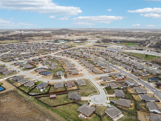 birds eye view of property with a residential view