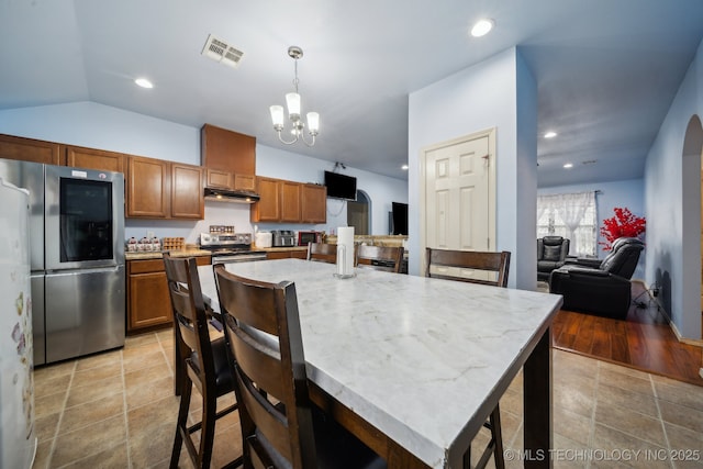 dining space featuring visible vents, recessed lighting, arched walkways, an inviting chandelier, and lofted ceiling