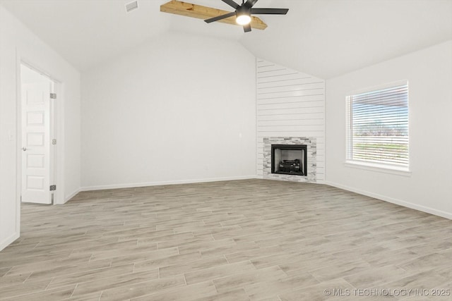 unfurnished living room featuring light wood-style flooring, a ceiling fan, and vaulted ceiling