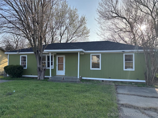 view of front of property with crawl space, a front yard, and a shingled roof