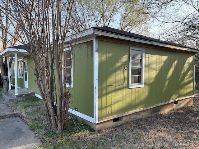 view of side of home featuring crawl space