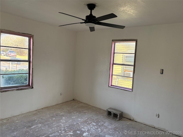 unfurnished room with a ceiling fan