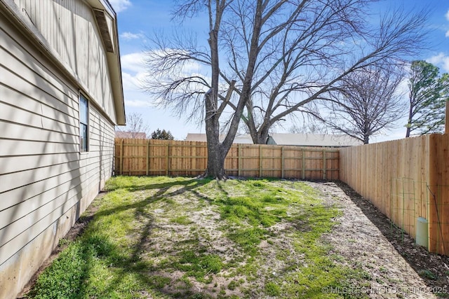 view of yard with a fenced backyard