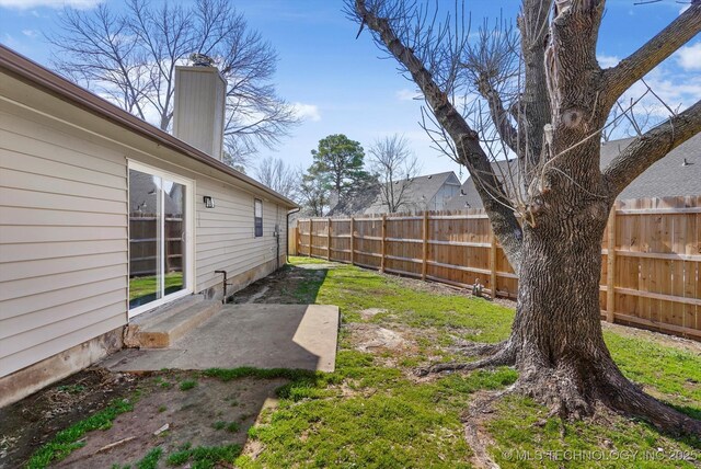 2426 S 104th E Ave, Tulsa, OK 74129 - fenced backyard featuring entry steps