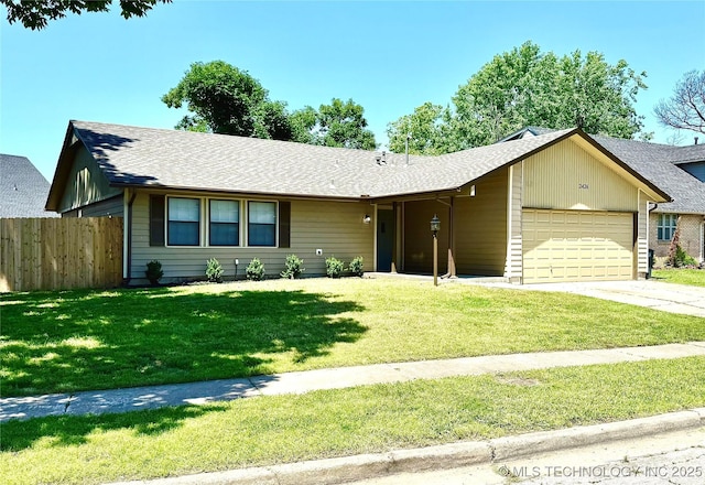 2426 S 104th E Ave, Tulsa, OK 74129 - ranch-style home featuring an attached garage, driveway, and a shingled roof