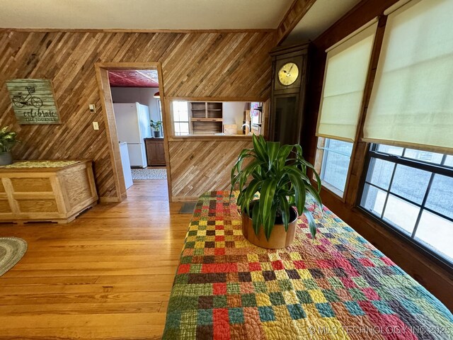 707 E 15th St, Okmulgee, OK 74447 - dining area with wooden walls, light wood finished floors, and healthy amount of natural light