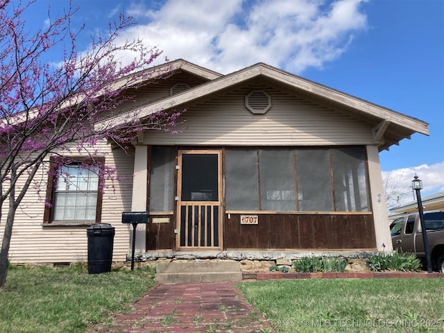 view of front of property with a sunroom