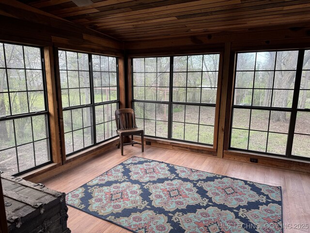 707 E 15th St, Okmulgee, OK 74447 - sunroom / solarium featuring wood ceiling and wood finished floors
