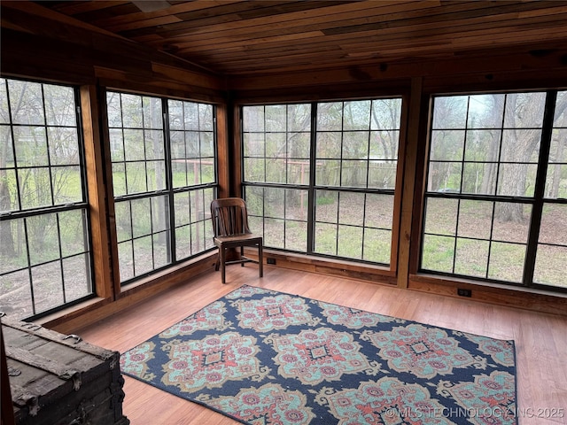 sunroom featuring wood ceiling