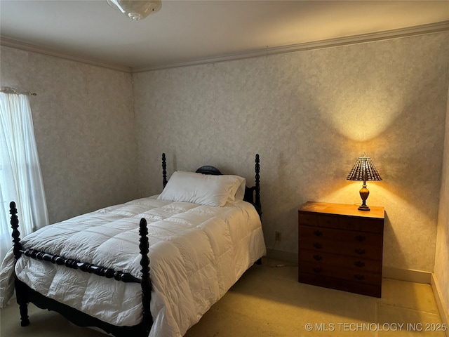 bedroom featuring baseboards and ornamental molding