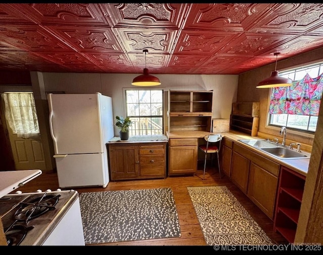 707 E 15th St, Okmulgee, OK 74447 - kitchen featuring freestanding refrigerator, open shelves, range, pendant lighting, and an ornate ceiling