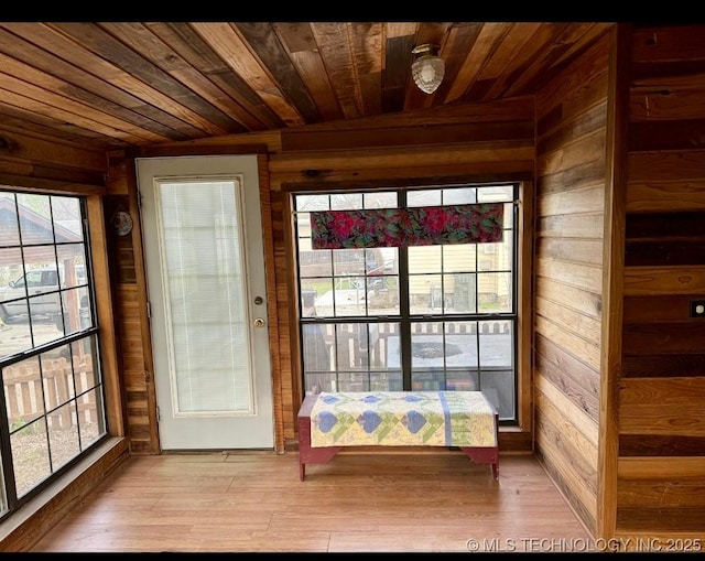 707 E 15th St, Okmulgee, OK 74447 - doorway to outside featuring wood walls, wood ceiling, and wood finished floors