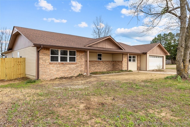 ranch-style home featuring brick siding, an attached garage, a shingled roof, and board and batten siding