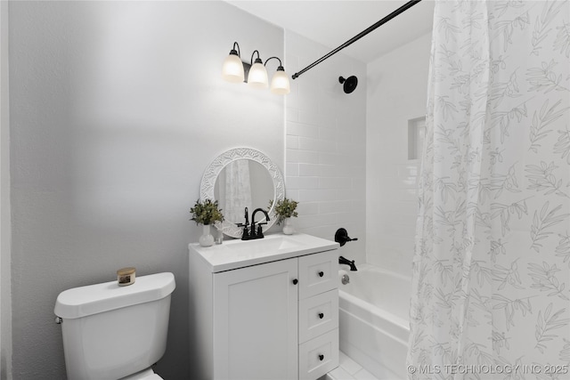 bathroom featuring vanity, shower / tub combo, and toilet