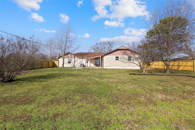 view of yard with a fenced backyard