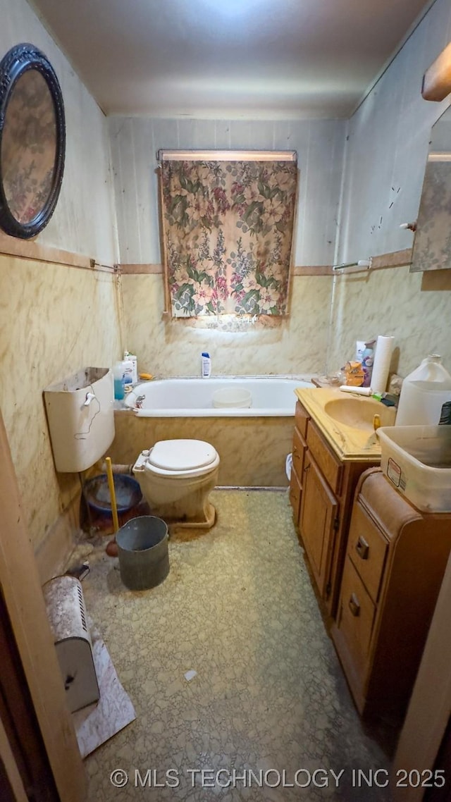 full bathroom featuring tile patterned floors, toilet, vanity, and a garden tub